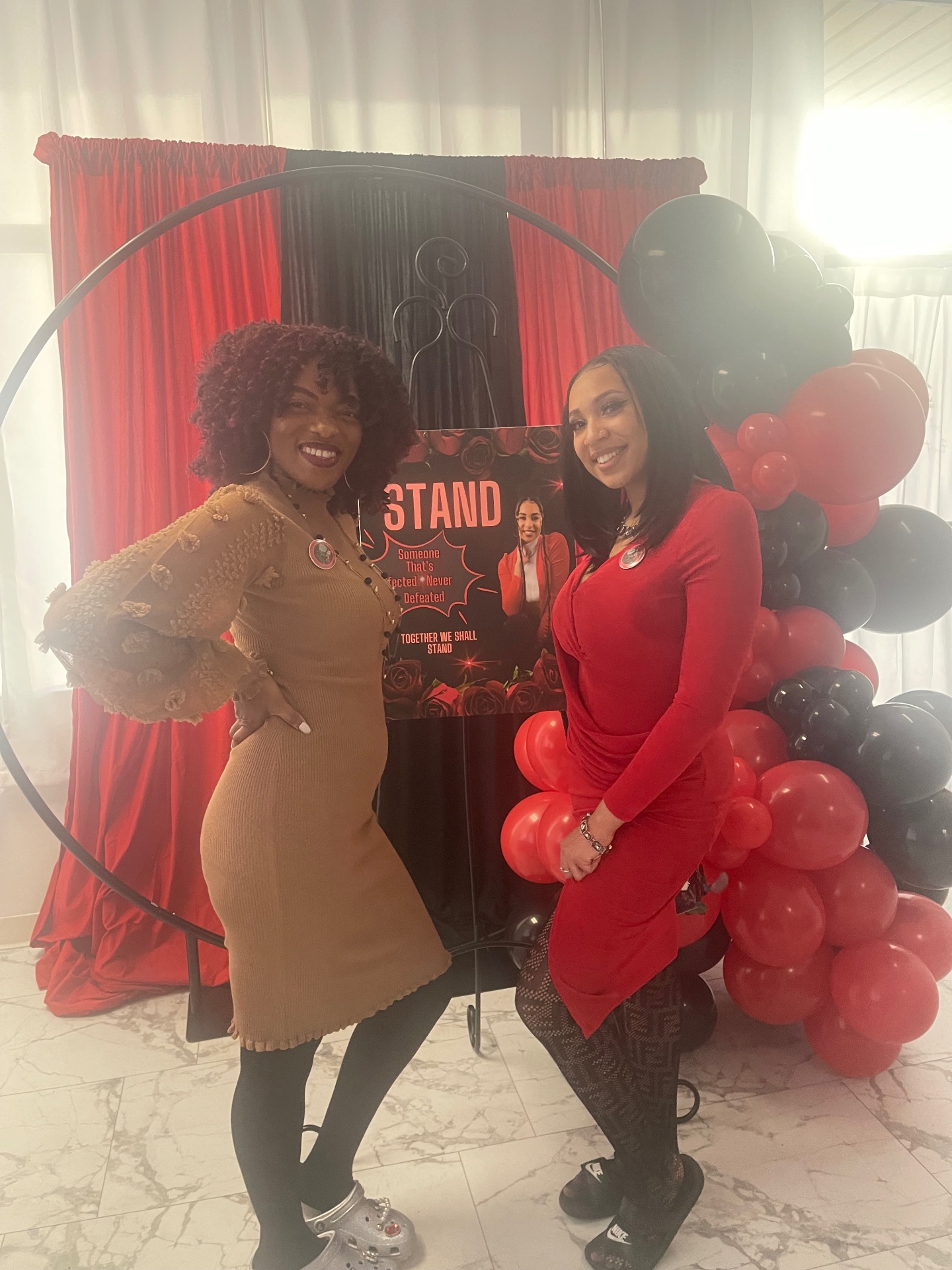 Red and black themed event with balloon garland