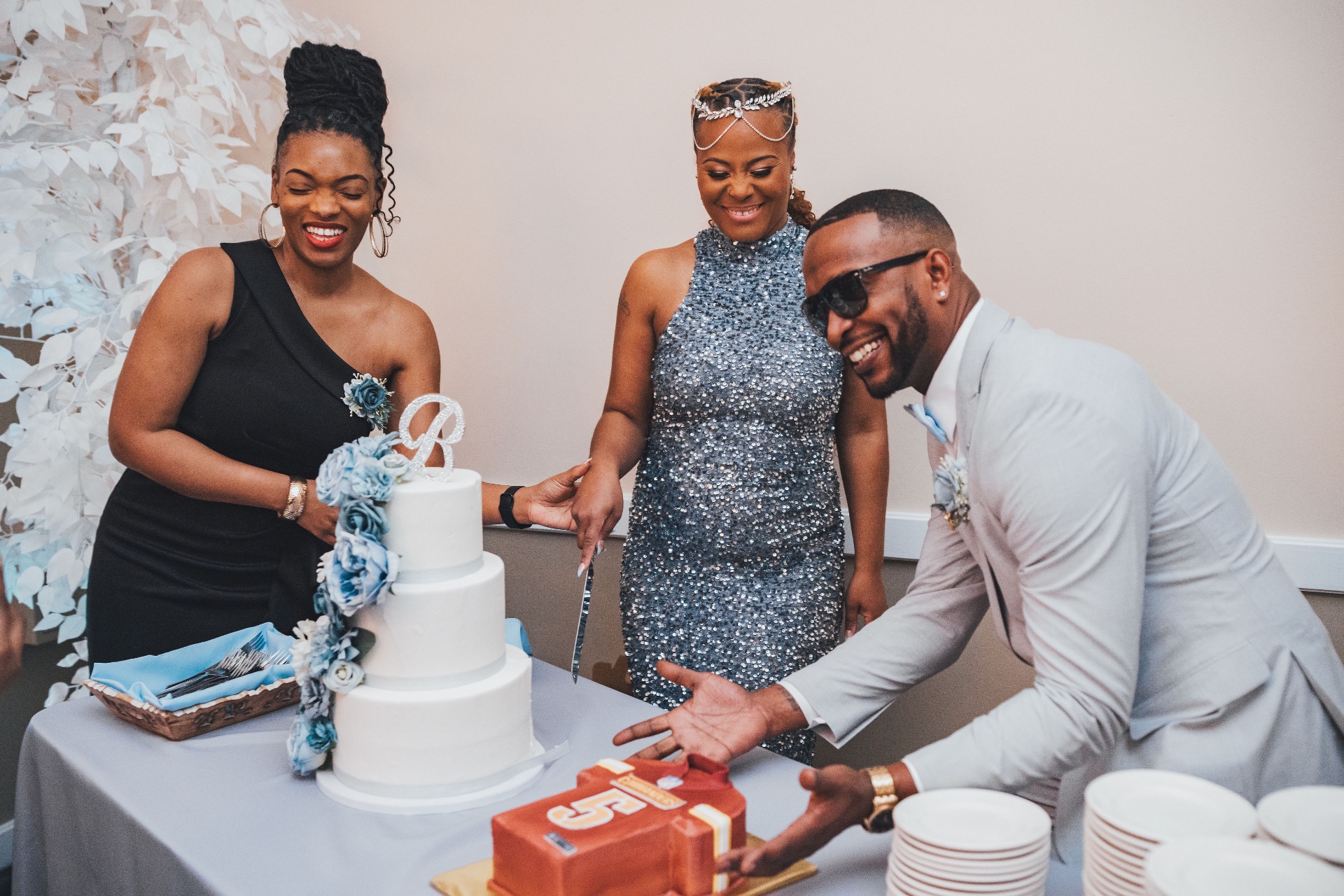 Cake cutting moment at a milestone birthday celebration
