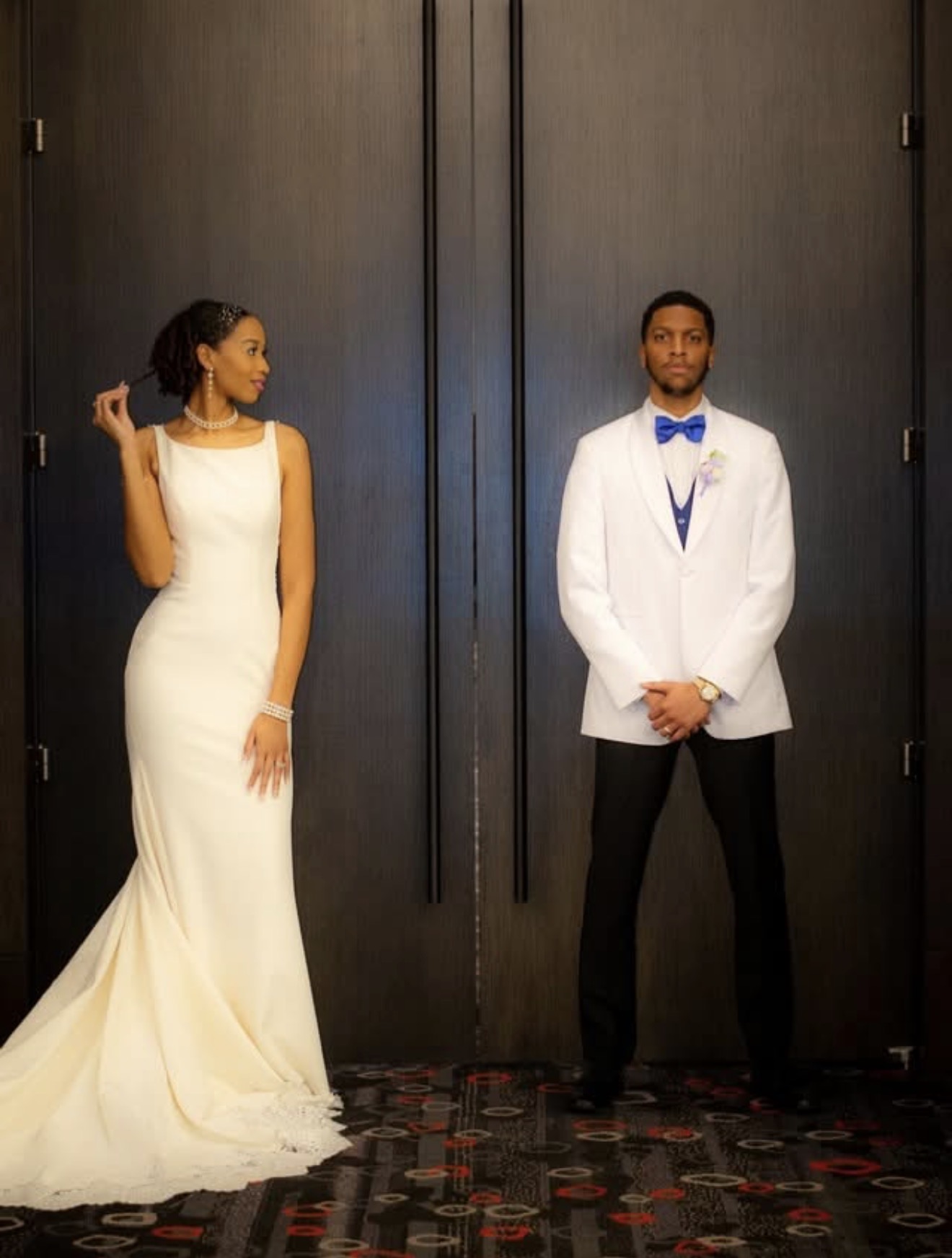 Elegant bride and groom formal portrait in white attire